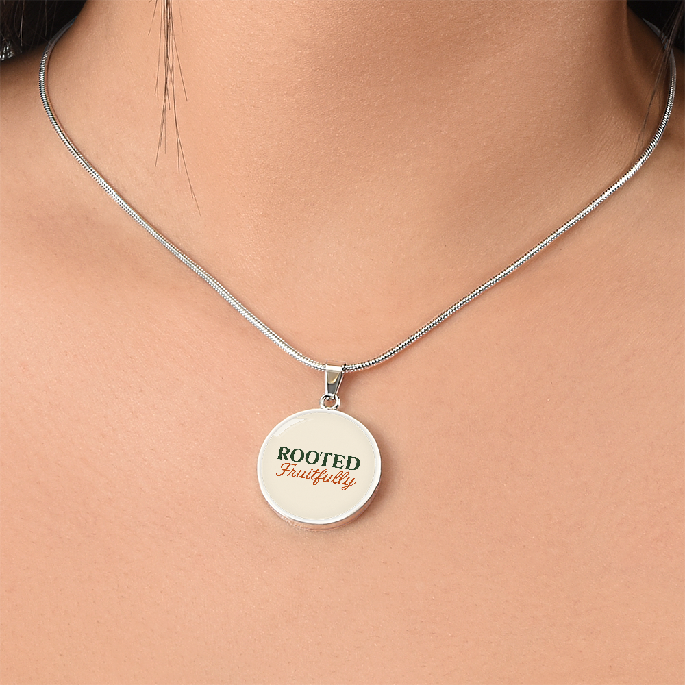 Hurry and get this Rooted Fruitfully round surgical steel necklace that looks great for all occasions, you be the judge.
